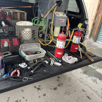 Tailgate workbench with service tools and extinguishers