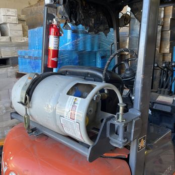 Fire extinguisher mounted on a forklift