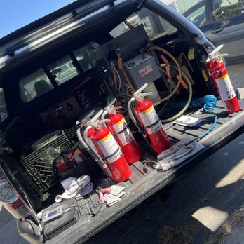 Mobile service truck stocked with recharged extinguishers